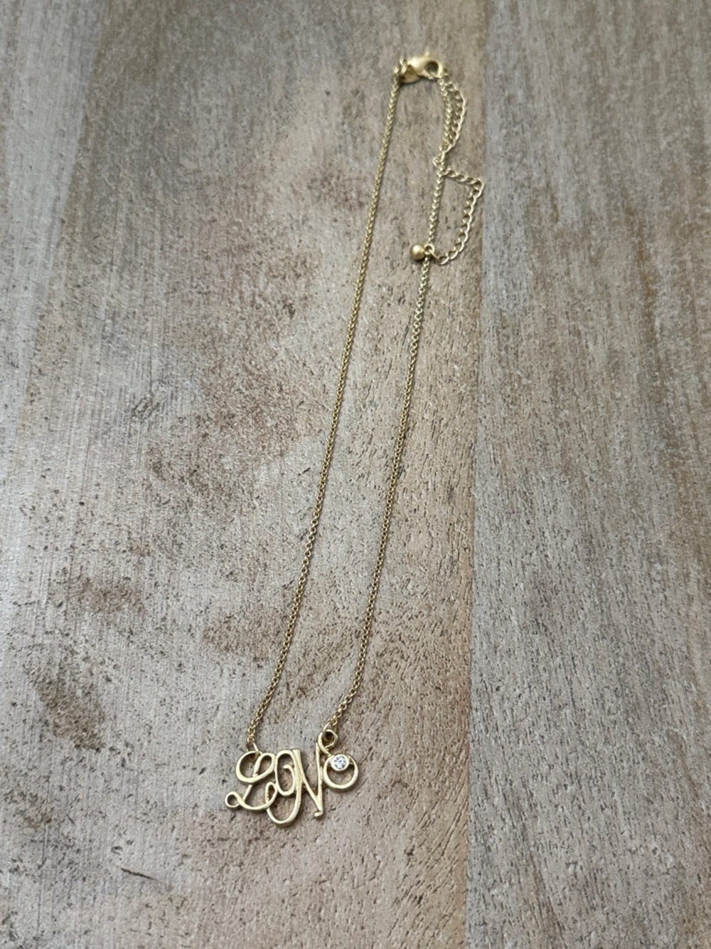 Lia Sophia love necklace. Gold Script Initial Necklace with Cubic Stone Accent
